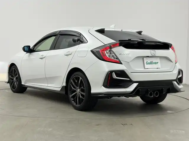 ホンダ シビック ハッチバック ホンダセンシング 愛知県 2021(令3)年 4.4万km プラチナホワイトパール 無限リアスポイラー/無限ドアミラー/Honda SENSING/衝突軽減ブレーキ/誤発進抑制機能/アダプティブクルーズコントロール/車線維持支援システム/バックカメラ/アジャイルハンドリングアシスト/電子制御パーキングブレーキ/オートブレーキホールド機能/マルチインフォメーションディスプレイ/純正7インチSDナビ/フルセグTV/DVD/CD/AM/FM/SD/USB/AUX/iPod/Bluetooth/本革巻きステアリング/ハーフレザーシート/シートヒーター/純正フロアマット/純正18インチアルミホイール/LEDヘッドライト/ETC2.0/前後ドライブレコーダー