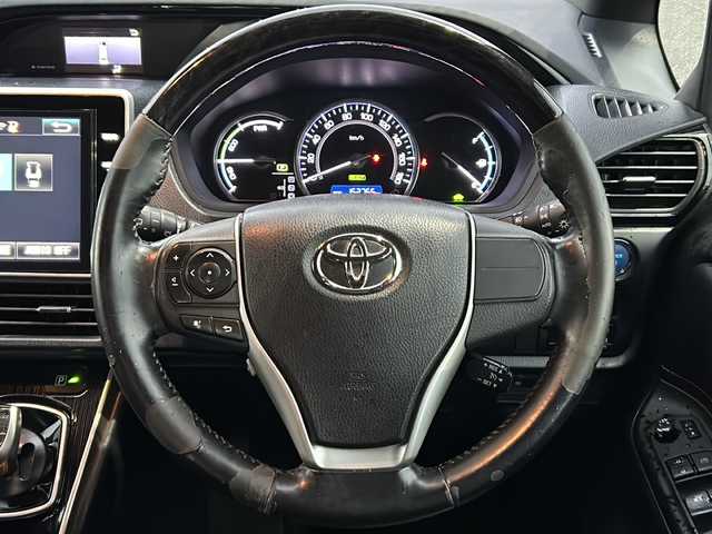 トヨタ エスクァイア ハイブリッド Gi ブラックテーラード 福島県 2016(平28)年 15.2万km ホワイトパールクリスタルシャイン 純正10インチナビ（TV/CD/DVD//Bluetooth/SD）　純正フリップダウンモニター　バックC　トヨタセーフティセンス　クルコン（追従無）　LEDヘッドライト　フォグランプ　オートライト　オートマチックハイビーム　ETC　ドラレコ（前方）　両側パワスラ　前席シートヒーター　スマートキー　プッシュスタート　ステアリングスイッチ　革巻きステアリング　社外15incAW車載（スタッドレスタイヤ）　純正フロアマット