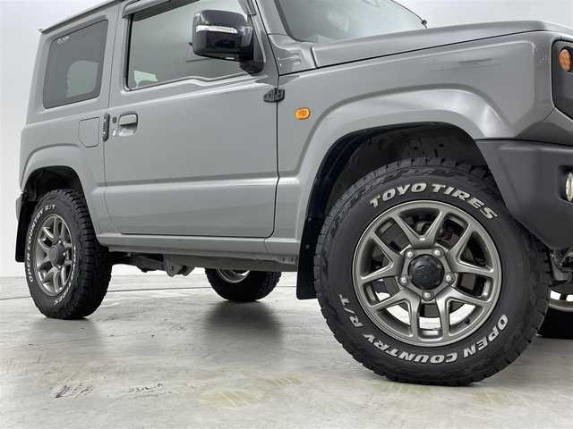 スズキ ジムニー XC 福岡県 2018(平30)年 5.2万km ミディアムグレー 純正８型ナビ　/フルセグTV　/バックカメラ　/ビルトインＥＴＣ　/前方ドラレコ　/クルーズコントロール　/衝突被害軽減ブレーキ　/レーンキープ　/ヒルディセントコントロール　/シートヒーター　/ホワイトレターＲＴタイヤ　/純正グリル積込有　/LEDヘッドライト