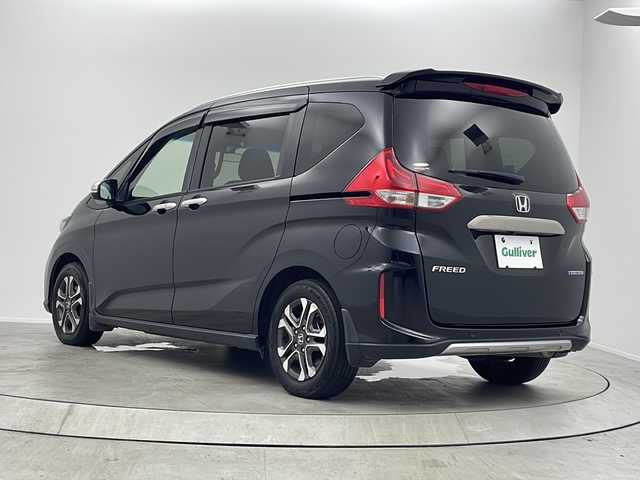 ホンダ フリード ハイブリット クロスター 大阪府 2022(令4)年 6.9万km クリスタルブラックパール 純正ナビ（ＢＴ，フルセグＴＶ）　/バックカメラ　/ＥＴＣ　/前後ドライブレコーダー　/アダプティブクルーズコントロール　/ホンダセンシング　/衝突被害軽減ブレーキ　/レーンキープ　/先行車発進お知らせ　/両側電動スライドドア　/ハーフレザーシート　/シートヒーター　/フロントガラス熱線スイッチ　/純正１５インチＡＷ