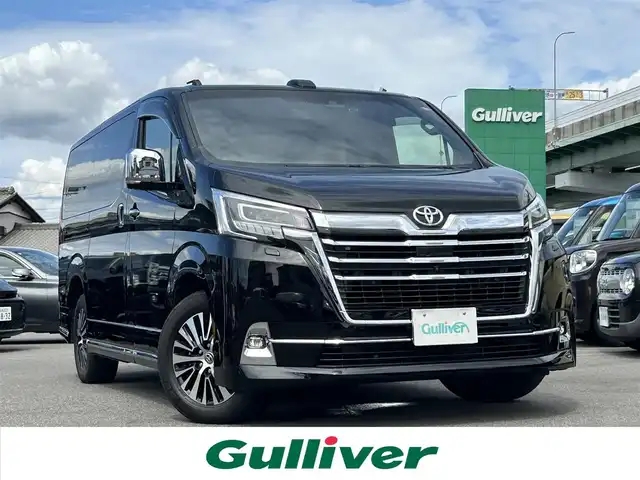 トヨタ グランエース プレミアム 愛知県 2022(令4)年 1.8万km ブラック デジタルインナーミラー /純正ナビ付きディスプレイオーディオ/フルセグTV/BT/パノラミックビューモニター/純正フリップダウンモニター/ビルトイン2.0ETC/純正17インチAW/トヨタセーフティセンス/ブラインドスポットモニター/レーダークルーズコントロール/前後ドライブレコーダー/両側パワースライドドア /ベージュレザーシート/前席パワーシート/前席シートヒーター /純正フロアマット/オットマン/取説、保証書/スペアキー