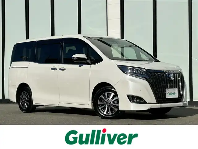 トヨタ エスクァイア ハイブリッド Gi プレミアムパッケージ ブラックテーラード 大阪府 2020(令2)年 6.8万km ホワイトパールクリスタルシャイン 純正１０インチナビ　/   フルセグＴＶ/CD/DVD/Bluetooth/トヨタセーフティセンス/コーナーセンサー　/バックモニター　/12.1インチフリップダウンモニター　/前席シートヒーター　/両側パワースライドドア　/前後ドライブレコーダー/オートマチックハイビーム/純正15インチアルミホイール/純正フロアマット　/ビルトインETC2.0/ＬＥＤ/取扱説明書/保証書/記録簿