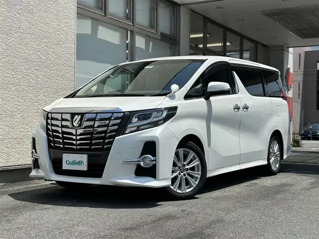 トヨタ アルファード S Aパッケージ 大阪府 2015(平27)年 9.2万km ホワイトパールクリスタルシャイン ワンオーナー/ALPINE11型ナビ/（フルセグ/BT/CD/DVD）/ALPINE11型フリップダウンモニター/バックカメラ/両側パワースライドドア/クルーズコントロール/横滑り防止システム/前後コーナーセンサー/純正18インチAW/プッシュスタート/オートライト/保証書/取扱説明書/スペアキー　有