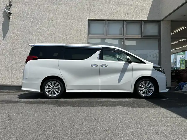 トヨタ アルファード S Aパッケージ 大阪府 2015(平27)年 9.2万km ホワイトパールクリスタルシャイン ワンオーナー/ALPINE11型ナビ/（フルセグ/BT/CD/DVD）/ALPINE11型フリップダウンモニター/バックカメラ/両側パワースライドドア/クルーズコントロール/横滑り防止システム/前後コーナーセンサー/純正18インチAW/プッシュスタート/オートライト/保証書/取扱説明書/スペアキー　有