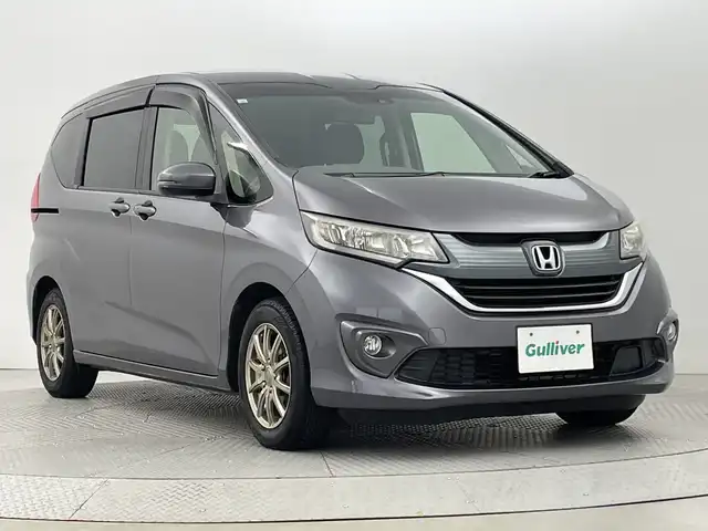 ホンダ フリード G ホンダセンシング 新潟県 2017(平29)年 6.7万km モダンスティールM ホンダセンシング/社外HDDナビ/　　CD/DVD/フルセグ/BT/AM/FM//両側パワースライドドア/アダプティブクルーズコントロール/オートライト/フォグランプ/スチールホイール付サマータイヤ車載(4ミリ)/アイドリングストップ/ミラーヒーター/ドアバイザー/純正フロアマット/スペアキー/スマートキー/ETC