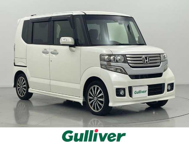 ホンダ Ｎ ＢＯＸ カスタム G ターボSSパッケージ 熊本県 2014(平26)年 6.1万km プレミアムホワイトパール 純正ナビVXM-155VSi（ＣＤ・ＤＶＤ・ワンセグ・ＢＴ）/バックカメラ　/社外前方ドライブレコーダー　/両側パワースライドドア　/ＥＴＣ　/安心パッケージ/ホンダセンシング/・衝突軽減ブレーキ/・誤発進制御機能/・車線維持支援システム/・歩行者事故低減ステアリング/・路外逸脱制御機能/・クルーズコントロール/横滑り防止/パドルシフト/純正フロアマット/純正１５インチAW/オートライト/HIDライト/フォグライト/スマートキー/プッシュスタート