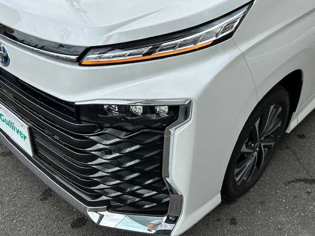 トヨタ ヴォクシー ハイブリッド S－Z 静岡県 2025(令7)年 0.3万km ホワイトパールクリスタルシャイン ワンオーナー/純正ナビ（フルセグTV・BT・FM・AM）/両側パワースライドドア/ブレーキホールド/EPD/ドライブモード/EVモード/シートヒーター/ハイブリッド/スペアキー１/アダプティブクルーズコントロール/純正アルミホイール/オートマチックハイビーム/車載音声アシスタント/デジタルインナーミラー/ウォークスルー/取扱説明書/保障証