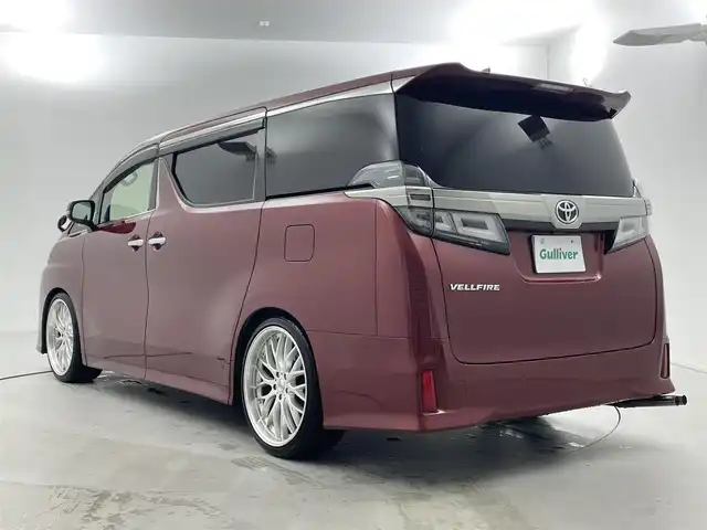 トヨタ ヴェルファイア Z Aエディション 福井県 2018(平30)年 5.8万km ダークレッドマイカメタリック サンルーフ/アルパインナビ/【AM/FM/CD/DVD/Bluetooth/フルセグTV】/アルパインフリップダウンモニター/バックカメラ/ETC/衝突軽減ブレーキ/車線逸脱警報機能/クルーズコントロール（追従有）/オートライト/オートハイビーム/LEDヘッドライド/LEDフォグライド/プッシュスタート/スマートキー/電動サイドブレーキ/ブレーキホールド機能/シートカバー/社外21インチアルミホイール/（純正ホイール車載）/社外マフラー/（純正マフラー車載）