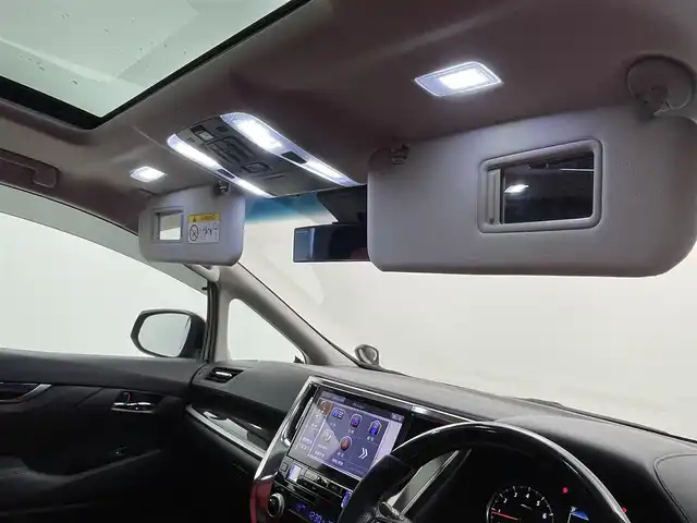 トヨタ ヴェルファイア Z Aエディション 福井県 2018(平30)年 5.8万km ダークレッドマイカメタリック サンルーフ/アルパインナビ/【AM/FM/CD/DVD/Bluetooth/フルセグTV】/アルパインフリップダウンモニター/バックカメラ/ETC/衝突軽減ブレーキ/車線逸脱警報機能/クルーズコントロール（追従有）/オートライト/オートハイビーム/LEDヘッドライド/LEDフォグライド/プッシュスタート/スマートキー/電動サイドブレーキ/ブレーキホールド機能/シートカバー/社外21インチアルミホイール/（純正ホイール車載）/社外マフラー/（純正マフラー車載）