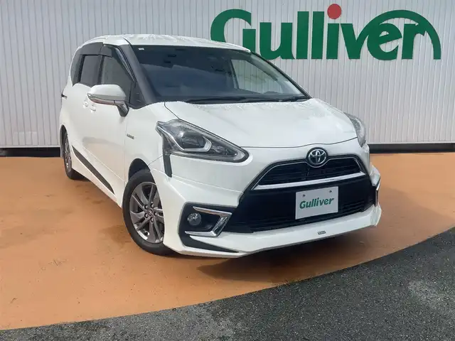 トヨタ シエンタ ハイブリッド G クエロ 三重県 2018(平30)年 7.4万km ホワイトパールクリスタルシャイン モデリスタエアロ/純正ナビ・ナビレディパッケージ/バックカメラ/セーフティセンス（衝突回避支援パッケージ/先行車発進告知機能）/パワースライドドア（運転席側/助手席側）/LEDヘッドランプ/オートライト/フロントフォグランプ/ボディ同色電動格納ドアミラー/185/60R15タイヤ/　＊15インチアルミホイール（オプション）/スマートエントリー/ プッシュスタート/社外マフラー（柿本改）/純正マフラー車内積み込み