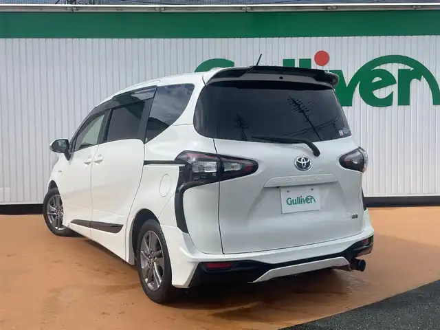 トヨタ シエンタ ハイブリッド G クエロ 三重県 2018(平30)年 7.4万km ホワイトパールクリスタルシャイン モデリスタエアロ/純正ナビ・ナビレディパッケージ/バックカメラ/セーフティセンス（衝突回避支援パッケージ/先行車発進告知機能）/パワースライドドア（運転席側/助手席側）/LEDヘッドランプ/オートライト/フロントフォグランプ/ボディ同色電動格納ドアミラー/185/60R15タイヤ/　＊15インチアルミホイール（オプション）/スマートエントリー/ プッシュスタート/社外マフラー（柿本改）/純正マフラー車内積み込み