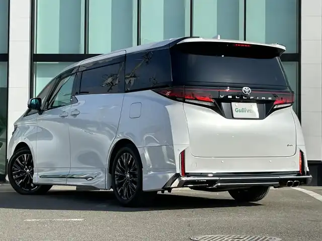 トヨタ ヴェルファイア ハイブリット Z プレミア 和歌山県 2023(令5)年 2.1万km プラチナホワイトパールマイカ モデリスタエアロ/サンルーフ/ユニバーサルステップ/シグネチャーイルミネーション/純正メーカーナビ/純正フリップダウンモニター/TVキャンセラー/デジタルインナーミラー/パノラミックビューモニター/プリクラッシュセーフティー/レーダークルーズコントロール/ブラインドスポットモニター/クリアランスソナー/両側パワースライドドア/パワーバックドア/パワーシート/シートヒーター/シートエアベンチレーション/前後ドライブレコーダー/純正アルミホイール/純正フロアマット/LEDヘッドライト/フォグランプ/オートライト/オートマチックハイビーム