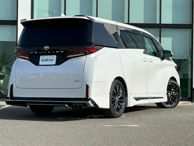 トヨタ ヴェルファイア ハイブリット Z プレミア 和歌山県 2023(令5)年 2.1万km プラチナホワイトパールマイカ モデリスタエアロ/サンルーフ/ユニバーサルステップ/シグネチャーイルミネーション/純正メーカーナビ/純正フリップダウンモニター/TVキャンセラー/デジタルインナーミラー/パノラミックビューモニター/プリクラッシュセーフティー/レーダークルーズコントロール/ブラインドスポットモニター/クリアランスソナー/両側パワースライドドア/パワーバックドア/パワーシート/シートヒーター/シートエアベンチレーション/前後ドライブレコーダー/純正アルミホイール/純正フロアマット/LEDヘッドライト/フォグランプ/オートライト/オートマチックハイビーム