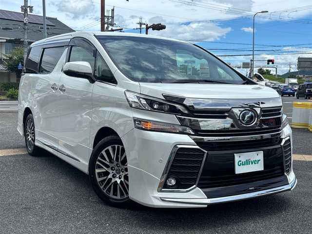 トヨタ ヴェルファイア ZA Gエディション 京都府 2017(平29)年 11.2万km ホワイトパールクリスタルシャイン  4WD ワンオーナー/ モデリスタスポイラー/ クロフルレザーシート/ シートヒーター/ アクセサリーコンセント　4ケ/ 両側パワースライドドア/ パワーリアゲート/ 純正9インチSDナビ　フルセグ/ フリップダウンモニター/ HDMIポート/ 純正18インチアルミ/ 保証書　取説あり