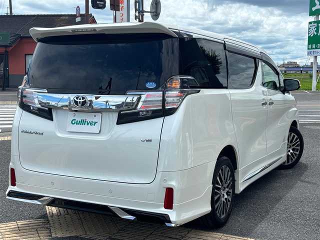 トヨタ ヴェルファイア ZA Gエディション 京都府 2017(平29)年 11.2万km ホワイトパールクリスタルシャイン  4WD ワンオーナー/ モデリスタスポイラー/ クロフルレザーシート/ シートヒーター/ アクセサリーコンセント　4ケ/ 両側パワースライドドア/ パワーリアゲート/ 純正9インチSDナビ　フルセグ/ フリップダウンモニター/ HDMIポート/ 純正18インチアルミ/ 保証書　取説あり