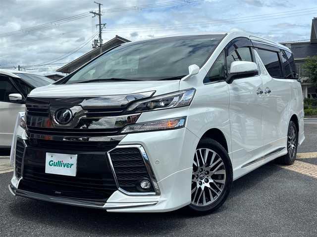 トヨタ ヴェルファイア ZA Gエディション 京都府 2017(平29)年 11.2万km ホワイトパールクリスタルシャイン  4WD ワンオーナー/ モデリスタスポイラー/ クロフルレザーシート/ シートヒーター/ アクセサリーコンセント　4ケ/ 両側パワースライドドア/ パワーリアゲート/ 純正9インチSDナビ　フルセグ/ フリップダウンモニター/ HDMIポート/ 純正18インチアルミ/ 保証書　取説あり