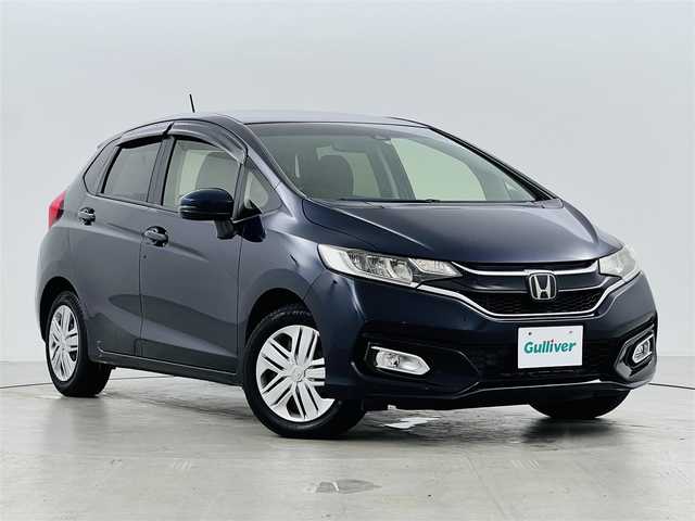 ホンダ フィット 13G L ホンダセンシング 福井県 2017(平29)年 4.5万km ミッドナイトブルービームM ホンダセンシング　/・レーダークルーズコントロール/・先行車発進告知/・車線逸脱警報/・レーンキープアシスト/・標識認識機能/バックカメラ　/ビルトインＥＴＣ　/ディスプレイオーディオ　/プッシュスタート　/・スマートキー　/・スペアキー　/ステアリングスイッチ　/オートライト　/・ＬＥＤライト　/・ＬＥＤフォグ　/・電動格納ミラー/電動格納ウィンカーミラー/純正フロアマット/ドアバイザー　