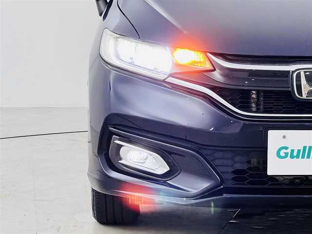 ホンダ フィット 13G L ホンダセンシング 福井県 2017(平29)年 4.5万km ミッドナイトブルービームM ホンダセンシング　/・レーダークルーズコントロール/・先行車発進告知/・車線逸脱警報/・レーンキープアシスト/・標識認識機能/バックカメラ　/ビルトインＥＴＣ　/ディスプレイオーディオ　/プッシュスタート　/・スマートキー　/・スペアキー　/ステアリングスイッチ　/オートライト　/・ＬＥＤライト　/・ＬＥＤフォグ　/・電動格納ミラー/電動格納ウィンカーミラー/純正フロアマット/ドアバイザー　