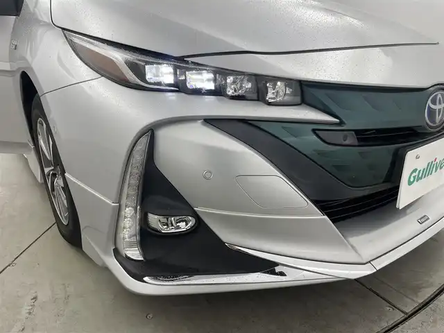 トヨタ プリウス ＰＨＶ Sナビパケ・セーフティプラス 岡山県 2018(平30)年 7.9万km シルバーM ・保証書/・取扱説明書/・電動格納ミラー/・ETC/・Toyota Safety Sense/・プリクラッシュセーフティ/・レーンディパーチャーアラート（操舵支援付）/・レーダークルコン/・オートハイビーム/・ふらつき検知機能/・ブラインドスポットモニター/・インテリジェントクリアランスソナー（巻き込み警報機能付）/SDナビゲーション/CD DVD フルセグTV/・前席シートヒータ/・ウィンカーミラー/・ハンドルヒータ/・ステアスイッチ/・ドライブレコーダー/・モデリスタフルエアロ