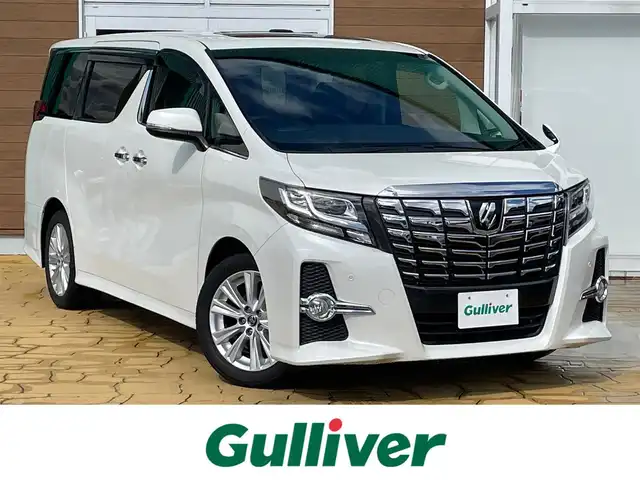 トヨタ アルファード S Aパッケージ 宮崎県 2015(平27)年 6.6万km ホワイトパールクリスタルシャイン 社外ナビ/Bluetooth（電話接続のみ）/ツインサンルーフ/両側パワースライドドア/バックカメラ/ETC/クルーズコントロール/ドライブレコーダー/LEDヘッドライト/純正18インチアルミ/純正フロアマット