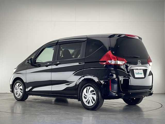 ホンダ フリード G ホンダセンシング 宮崎県 2021(令3)年 1.3万km クリスタルブラックパール 禁煙車/ホンダセンシング/純正ディスプレイオーディオTV/（Gathers/WX-211C/CD/FMAM/ワンセグTV)/純正バックカメラ/純正ビルトインETC/純正LEDオートライト/純正フロアマット/両側電動スライドドア/アダプティブクルーズコントロール/レーンディパーチャーアラート/オートエアコン/ハーフシェイドガラス/スマートキー/プッシュエンジンスタート/スペアキー/新車時保証書/取扱い説明書