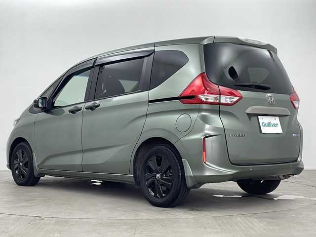 ホンダ フリード ハイブリット G ブラックスタイル 鹿児島県 2022(令4)年 2.3万km シルバーミストグリーンM 純正ディーラーOPナビ/(BT/CD/DVD/AM/FM/フルセグTV)/ホンダセンシング/純正後席フリップダウンモニター/レーダークルーズコントロール/バックカメラ/両側パワースライドドア/オートマチックハイビーム/レーンキープアシスト/後方のみコーナーセンサー/前席シートヒーター/アイドリングストップ/純正ビルトインETC/3列シート/ウォークスルー/純正LEDヘッドライト