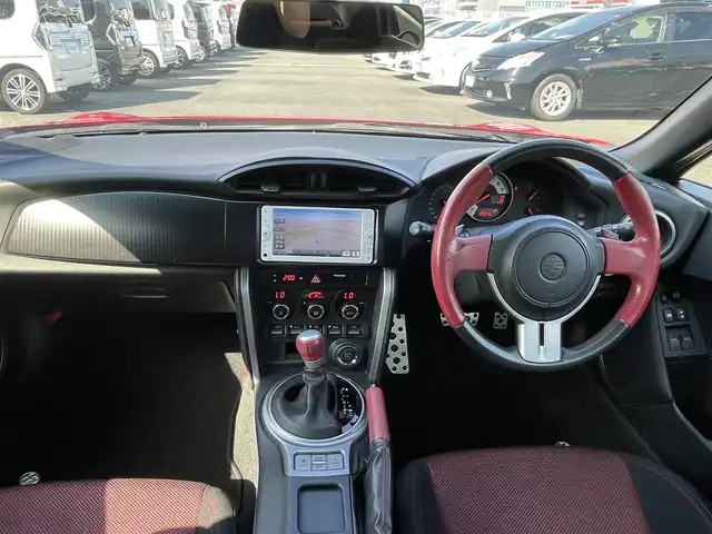 トヨタ ８６ GT 熊本県 2012(平24)年 10.3万km ライトニングレッド (株)IDOMが運営する【じしゃロン熊本店】の自社ローン専用車両になります。/こちらは現金またはオートローンご利用時の価格です。自社ローンご希望の方は別途その旨お申付け下さい/純正ナビ（ＣＤ　ＤＶＤ　ＳＤ　ワンセグＴＶ　ＢＴ）　/バックカメラ　/ＥＴＣ　/パドルシフト　/ＨＩＤヘッドライト　/Ｗ＋サイドエアバッグ　/カーテンエアバッグ　/プッシュスタート　/スマートキー　/電動格納ミラー