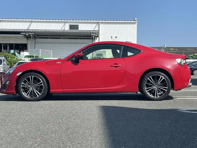 トヨタ ８６ GT 熊本県 2012(平24)年 10.3万km ライトニングレッド (株)IDOMが運営する【じしゃロン熊本店】の自社ローン専用車両になります。/こちらは現金またはオートローンご利用時の価格です。自社ローンご希望の方は別途その旨お申付け下さい/純正ナビ（ＣＤ　ＤＶＤ　ＳＤ　ワンセグＴＶ　ＢＴ）　/バックカメラ　/ＥＴＣ　/パドルシフト　/ＨＩＤヘッドライト　/Ｗ＋サイドエアバッグ　/カーテンエアバッグ　/プッシュスタート　/スマートキー　/電動格納ミラー