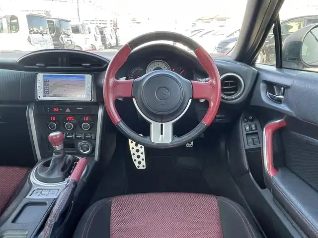 トヨタ ８６ GT 熊本県 2012(平24)年 10.3万km ライトニングレッド (株)IDOMが運営する【じしゃロン熊本店】の自社ローン専用車両になります。/こちらは現金またはオートローンご利用時の価格です。自社ローンご希望の方は別途その旨お申付け下さい/純正ナビ（ＣＤ　ＤＶＤ　ＳＤ　ワンセグＴＶ　ＢＴ）　/バックカメラ　/ＥＴＣ　/パドルシフト　/ＨＩＤヘッドライト　/Ｗ＋サイドエアバッグ　/カーテンエアバッグ　/プッシュスタート　/スマートキー　/電動格納ミラー