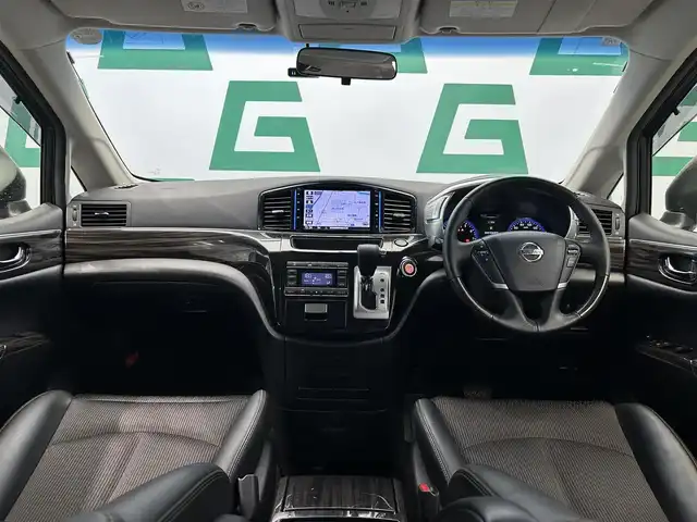 日産 エルグランド 250HWS S アーバンクロム 鹿児島県 2018(平30)年 7.7万km ファントムブラック 純正ナビ　/フルセグＴＶ/Ｂｌｕｅｔｏｏｔｈ　/バックカメラ　/前方ドラレコ　/両側パワスラ　/ＬＥＤヘッドライト　/フリップダウンモニター　/ロール式サンシェード　/カーテンエアバッグ　/スマートキー　/ハーフレザーシート/Pスタート/オットマン/革巻きステアリング/電格ミラー/フロントフォグランプ　/純正ドアバイザー
