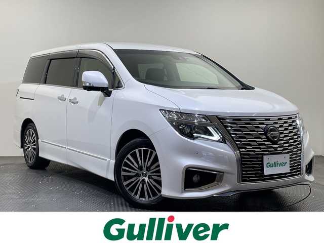 日産 エルグランド 250ハイウェイスターS 愛媛県 2022(令4)年 2.1万km ピュアホワイトパール 純正ナビ/Bluetooth/フルセグ/USB/全周囲カメラ/衝突被害軽減ブレーキ/レーンキープアシスト/前後コーナーセンサー/レーダークルーズコントロール/ETC/LEDヘッドライト/ブラインドスポットモニター/両側電動スライドドア/ドライブレコーダー/純正フロアマット/オットマン/スペアキ‐
