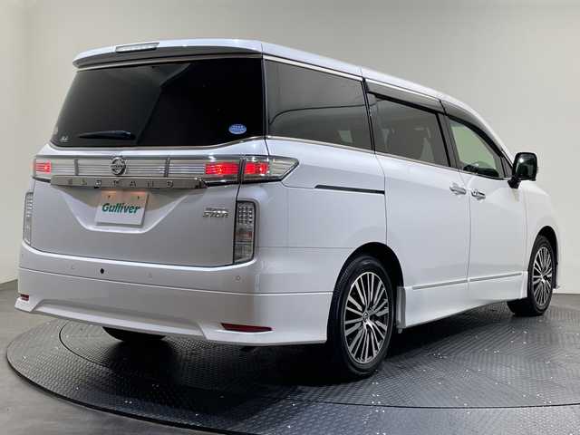 日産 エルグランド 250ハイウェイスターS 愛媛県 2022(令4)年 2.1万km ピュアホワイトパール 純正ナビ/Bluetooth/フルセグ/USB/全周囲カメラ/衝突被害軽減ブレーキ/レーンキープアシスト/前後コーナーセンサー/レーダークルーズコントロール/ETC/LEDヘッドライト/ブラインドスポットモニター/両側電動スライドドア/ドライブレコーダー/純正フロアマット/オットマン/スペアキ‐
