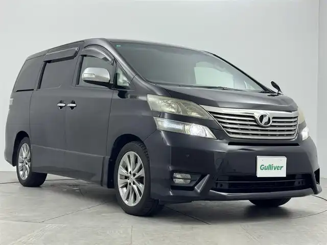 トヨタ ヴェルファイア 2．4Z プラチナセレⅡ ゴールド 愛知県 2011(平23)年 13.1万km ブラック ２．４Ｚ　プラチナセレクションII　タイプゴールド/両側パワースライドドア/電動リアゲート/三列シート/ウォークスルー/clarion　7インチナビ/（CD/DVD/BT/フルセグ）/バックカメラ/ETC/横滑り防止/前後コーナーセンサー/HIDヘッドライト/ステアリングスイッチ/MTモード/フォグランプ/ドアバイザー/純正AW