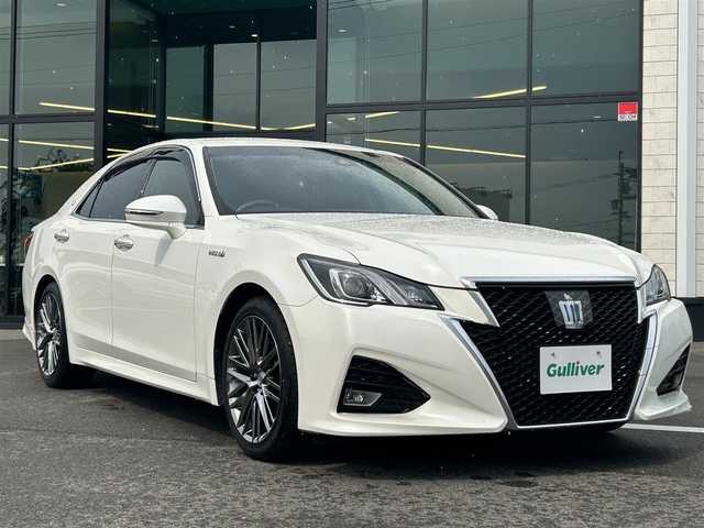 トヨタ クラウン ハイブリッド アスリートS J－フロンティア 愛媛県 2017(平29)年 8.3万km ホワイトパールクリスタルシャイン 純正ナビ(フルセグTV/DVD/Blu-ray/Bluetooth)/レーダークルーズコントロール/バックカメラ/ETC/シートヒーター/ステアリングヒーター/パワーシート/ハーフレザーシート/前後コーナーセンサー/純正アルミホイール/純正ドアバイザー/フロアマット/LEDヘッドライト/フォグランプ/オートライト/レーンキープアシスト/横滑り防止装置/盗難防止装置/衝突軽減装置/カーテンエアバッグ/ABS