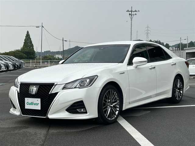 トヨタ クラウン ハイブリッド アスリートS J－フロンティア 愛媛県 2017(平29)年 8.3万km ホワイトパールクリスタルシャイン 純正ナビ(フルセグTV/DVD/Blu-ray/Bluetooth)/レーダークルーズコントロール/バックカメラ/ETC/シートヒーター/ステアリングヒーター/パワーシート/ハーフレザーシート/前後コーナーセンサー/純正アルミホイール/純正ドアバイザー/フロアマット/LEDヘッドライト/フォグランプ/オートライト/レーンキープアシスト/横滑り防止装置/盗難防止装置/衝突軽減装置/カーテンエアバッグ/ABS