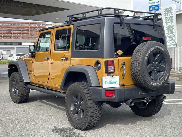 クライスラー・ジープ ジープ ラングラー アンリミテッド スポーツ 福岡県 2013(平25)年 6.9万km オレンジ 社外ナビ【カロッツェリア】/　Ｂｌｕｅｔｏｏｔｈ・フルセグＴＶ・ＣＤ・ＤＶＤ　/クルーズコントロール　/デジタルインナーミラー　/後席モニター/ヒーテッドドアミラー　/バックカメラ　/ＭＴモード付ＡＴ車　/ルーフキャリア/トランスファーレバー/スペアキー１本/リモコンキー/純正フロアマット/ダウンヒルアシストコントロール/パワーウィンドウ/横滑り防止装置/取扱説明書