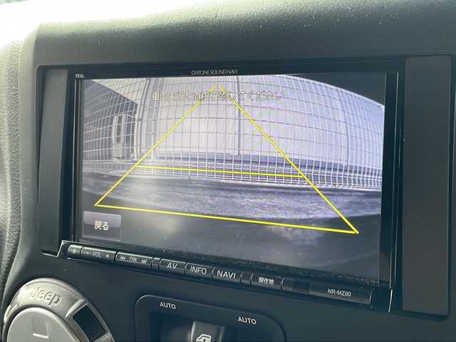 クライスラー・ジープ ジープ ラングラー アンリミテッド スポーツ 福岡県 2013(平25)年 6.9万km オレンジ 社外ナビ【カロッツェリア】/　Ｂｌｕｅｔｏｏｔｈ・フルセグＴＶ・ＣＤ・ＤＶＤ　/クルーズコントロール　/デジタルインナーミラー　/後席モニター/ヒーテッドドアミラー　/バックカメラ　/ＭＴモード付ＡＴ車　/ルーフキャリア/トランスファーレバー/スペアキー１本/リモコンキー/純正フロアマット/ダウンヒルアシストコントロール/パワーウィンドウ/横滑り防止装置/取扱説明書