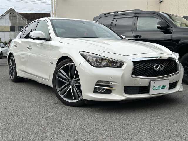 日産 スカイライン ハイブリッド 350GT タイプSP 60thLTD 和歌山県 2017(平29)年 3.3万km ブリリアントホワイトパール 純正ナビ/（AM/FM/CD/DVD/USB/AUX/Bluetooth/TV）/アラウンドビュー＆リアモニター/クリアランスソナー/サイドカメラ/クルーズコントロール（追従有）/D/Nシートヒーター/D/Nパワーシート/パドルシフト/前後ドライブレコーダー/オートライト/プッシュスタート/オートライト/純正ホイール/保証書