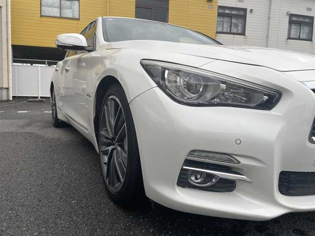 日産 スカイライン ハイブリッド 350GT タイプSP 60thLTD 和歌山県 2017(平29)年 3.3万km ブリリアントホワイトパール 純正ナビ/（AM/FM/CD/DVD/USB/AUX/Bluetooth/TV）/アラウンドビュー＆リアモニター/クリアランスソナー/サイドカメラ/クルーズコントロール（追従有）/D/Nシートヒーター/D/Nパワーシート/パドルシフト/前後ドライブレコーダー/オートライト/プッシュスタート/オートライト/純正ホイール/保証書