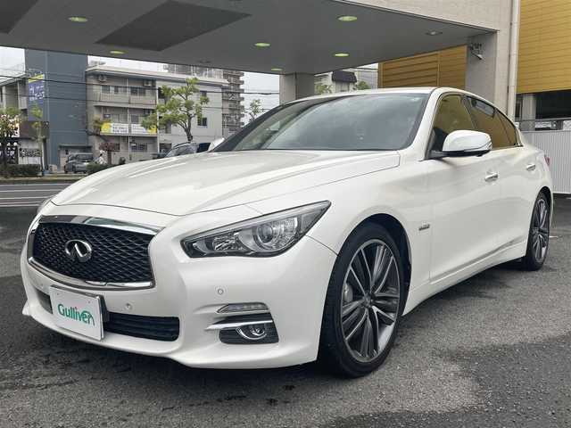 日産 スカイライン ハイブリッド 350GT タイプSP 60thLTD 和歌山県 2017(平29)年 3.3万km ブリリアントホワイトパール 純正ナビ/（AM/FM/CD/DVD/USB/AUX/Bluetooth/TV）/アラウンドビュー＆リアモニター/クリアランスソナー/サイドカメラ/クルーズコントロール（追従有）/D/Nシートヒーター/D/Nパワーシート/パドルシフト/前後ドライブレコーダー/オートライト/プッシュスタート/オートライト/純正ホイール/保証書
