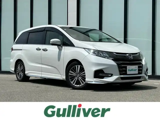 ホンダ オデッセイ アブソルート ホンダセンシング 大阪府 2019(令1)年 6.4万km プラチナホワイトパール 純正９インチナビ/   フルセグTV/CD/DVD/Bluetooth/USB/バックモニター/衝突軽減ブレーキ/横滑り防止装置/両側パワースライドドア/運転席パワーシート/レーダークルーズコントロール/レーンキープアシスト/パドルシフト/アイドリングストップ/ドライブレコーダー/純正17インチアルミホイール/純正フロアマット/プッシュスタート/スマートキー/ＥＴＣ/ＬＥＤ/禁煙車