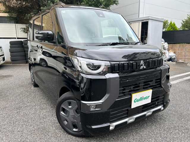 三菱 デリカミニ G 東京都 2024(令6)年 0.1万km未満 アメジストブラック 登録時走行72km/e-アシスト（運転支援機能）/・衝突被害軽減ブレーキシステム/・前方衝突予測警報/・踏み間違い衝突防止アシスト/・標識検知システム/・車線逸脱警報システム/・車線逸脱防止支援機能/・先行車発進通知/・オートマチックハイビーム/・ふらつき警報/前席シートヒーター/ルーフレール/バックカメラ/ハンズフリーパワースライドドア/ハーフレザーシート（合皮）/LEDライト/スマートキー/オートエアコン/保証書・取説/スペアキー