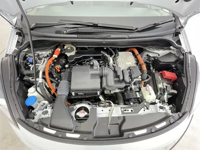 ホンダ フィット e:HEVホーム 千葉県 2021(令3)年 2.2万km プレミアムサンライトホワイトパール 禁煙車/ワンオーナー/ホンダセンシング/・衝突軽減ブレーキ〈CMBS〉/・誤発進抑制機能/・後方誤発進抑制機能/・近距離衝突軽減ブレーキ/・歩行者事故低減ステアリング/・路外逸脱抑制機能/・渋滞追従機能付アダプティブ・クルーズ・コントロール〈ACC〉/・車線維持支援システム〈LKAS〉/・先行車発進お知らせ機能/・標識認識機能/・オートハイビーム/純正9型ナビ（LXM-242ZFNi）/CD DVD SD USB Bluetooth/フルセグTV/バックカメラ/ETC/LEDオートライト/コーナーセンサー/横滑り防止機能/電動サイドブレーキ/オートブレーキホールド/ステアリングスイッチ/純正フロアマット/スペアキー/保証書/取扱説明書
