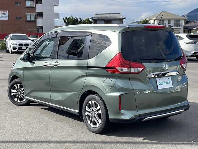 ホンダ フリード＋ ハイブリット クロスター ホンダセンシング 沖縄県 2020(令2)年 6.2万km シルバーミストグリーンM 県外仕入れ/禁煙車/ホンダセンシング/（衝突軽減ブレーキ/誤発進抑制機能/後方誤発進抑制機能/歩行者事故低減ステアリング/路外逸脱抑制機能/アダプティブクルーズコントロール/車線維持支援システム/先行車発進お知らせ機能/標識認識機能)/社外ナビ[MDV-D707BT]/（AM/FM/CD/DVD/BT//フルセグ）/バックカメラ/両側パワースライドドア/前後ドライブレコーダー/LEDオートライト/ハーフレザーシート/純正１５インチアルミホイール/純正フロアマット/スマートキー/ETC