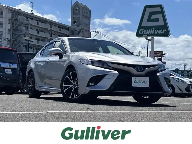 トヨタ カムリ WSレザーパッケージ 大分県 2019(令1)年 1.1万km シルバーマイカM ・純正ナビ(CD.DVD.USB.BT.SD.AUX)/・フルセグテレビ/・バックカメラ/・ヘッドアップディスプレイ/・プリクラッシュセーフティ/・ブラインドスポットモニター/・コーナーセンサー/・ドライブレコーダー/・シートヒーター/・パワーシート/・ステアリングリモコン/・パドルシフト/・オートハイビーム/・オートライト/・ブレーキホールド/・スマートキー/・プッシュスタートボタン