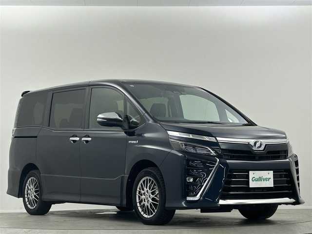 トヨタ ヴォクシー ハイブリッド ZS 煌Ⅱ 埼玉県 2019(令1)年 3.8万km ブラッキッシュアゲハガラスフレーク 純正９インチナビＴＶ　後席フリップダウンモニター　両側パワースライドドア　クルーズコントロール　ビルトインＥＴＣ　ＬＥＤヘッド　ＬＥＤフォグ　シートヒーター　ドライブレコーダー　専用ＢＢＳホイル