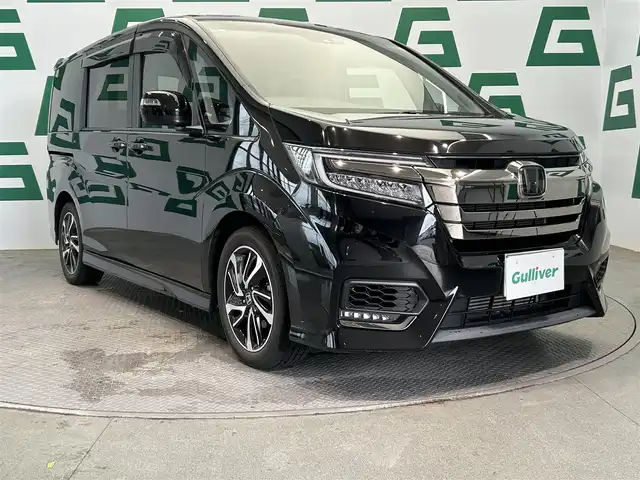 ホンダ ステップワゴン スパーダ クルスピセンシング 鹿児島県 2021(令3)年 1.8万km プレミアムスパークルブラックパール 純正ナビ【ＶＸＵ－２０７ＳＷｉ】　/バックカメラ　/ホンダセンシング　/純正フリップダウンモニター　/革巻きステアリング　/パドルシフト　/ステアリングリモコン　/電動格納ミラー　/サンシェード　/ＥＴＣ　/禁煙車