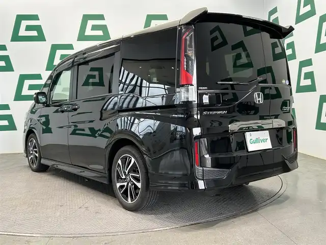 ホンダ ステップワゴン スパーダ クルスピセンシング 鹿児島県 2021(令3)年 1.8万km プレミアムスパークルブラックパール 純正ナビ【ＶＸＵ－２０７ＳＷｉ】　/バックカメラ　/ホンダセンシング　/純正フリップダウンモニター　/革巻きステアリング　/パドルシフト　/ステアリングリモコン　/電動格納ミラー　/サンシェード　/ＥＴＣ　/禁煙車