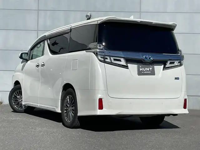 トヨタ ヴェルファイア ハイブリット エグゼクティブ ラウンジ Z 千葉県 2018(平30)年 4.5万km ホワイトパールクリスタルシャイン 4WD/純正ナビ/フルセグＴＶ/全方位カメラ/サンルーフ/ＪＢＬサウンド/両側パワースライドドア/クルーズコントロール/オットマン/パワーバックドア/前席シートヒーター/前席エアシート/前席パワーシート/ステアリングヒーター/衝突被害軽減ブレーキ/レーンキープアシスト/ＢＳＭ