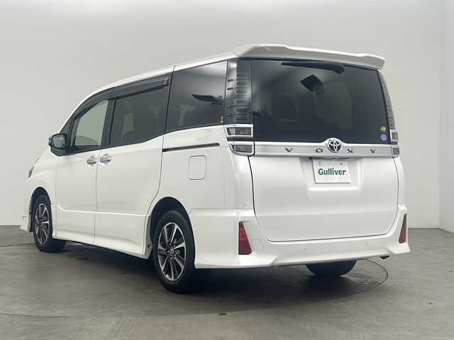 トヨタ ヴォクシー ZS 煌Ⅱ 兵庫県 2019(令1)年 2万km ホワイトパールクリスタルシャイン ・純正ナビ/CD/DVD/BT/TV/SD/・トヨタセーフティセンス/・衝突軽減システム/・横滑り防止装置/・レーンキープアシスト/・クルーズコントロール/・バックカメラ/・アイドリングストップ/・モデリスタエアロ（フロント）/・MTモード付AT/・盗難防止装置/・前方ドライブレコーダー/・前後コーナーセンサー/・両側パワースライドドア/・LEDオートライト/・オートマチックハイビーム/・ビルトインETC/・ステアリングリモコン/・革巻きステアリング/・スマートキー/・プッシュスタート/・WAC/・純正フロアマット/・純正１６インチアルミホイール/・電動格納ミラー/・サンシェード/・ドアバイザー/・Wエアバッグ/・カーテンエアバッグ
